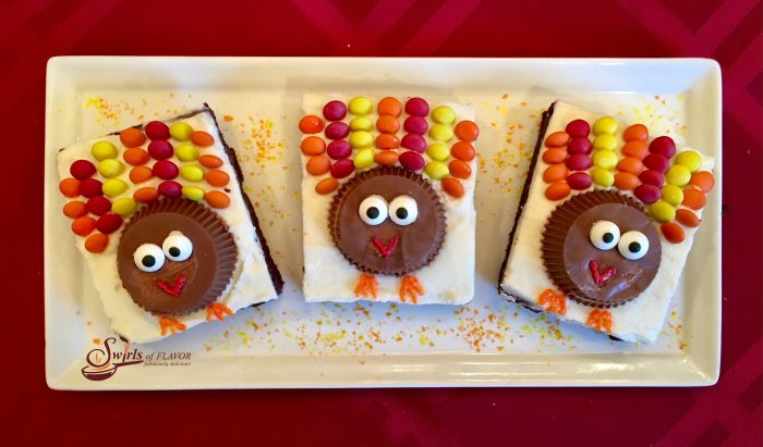 A rich fudgy homemade brownie is topped with a creamy vanilla buttercream.....and candy turkeys. So much fun to make and eat! Turkey Brownies are guaranteed to become a holiday tradition! 