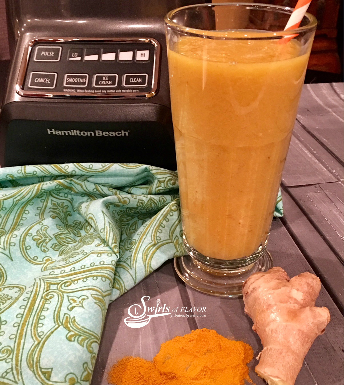 Banana Mango Smoothie With turmeric in a tall glass