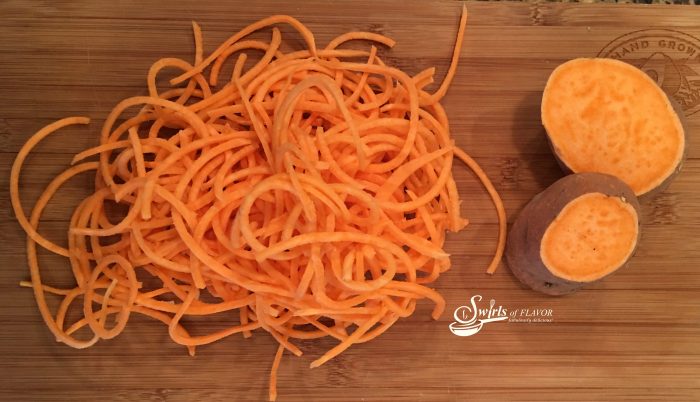 Brown Sugar Cinnamon Sweet Potato Noodles, an updated trendy version of the steakhouse favorite, are spiralized noodles coated in a buttery sauce with a hint of spice! Fun and fancy and perfect for your holiday table! sweet potato noodles | spiralized noodles | baked sweet potato | brown sugar cinnamon butter | spiralizer