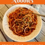 a bowl of spiralized sweet potato noodles with text overlay