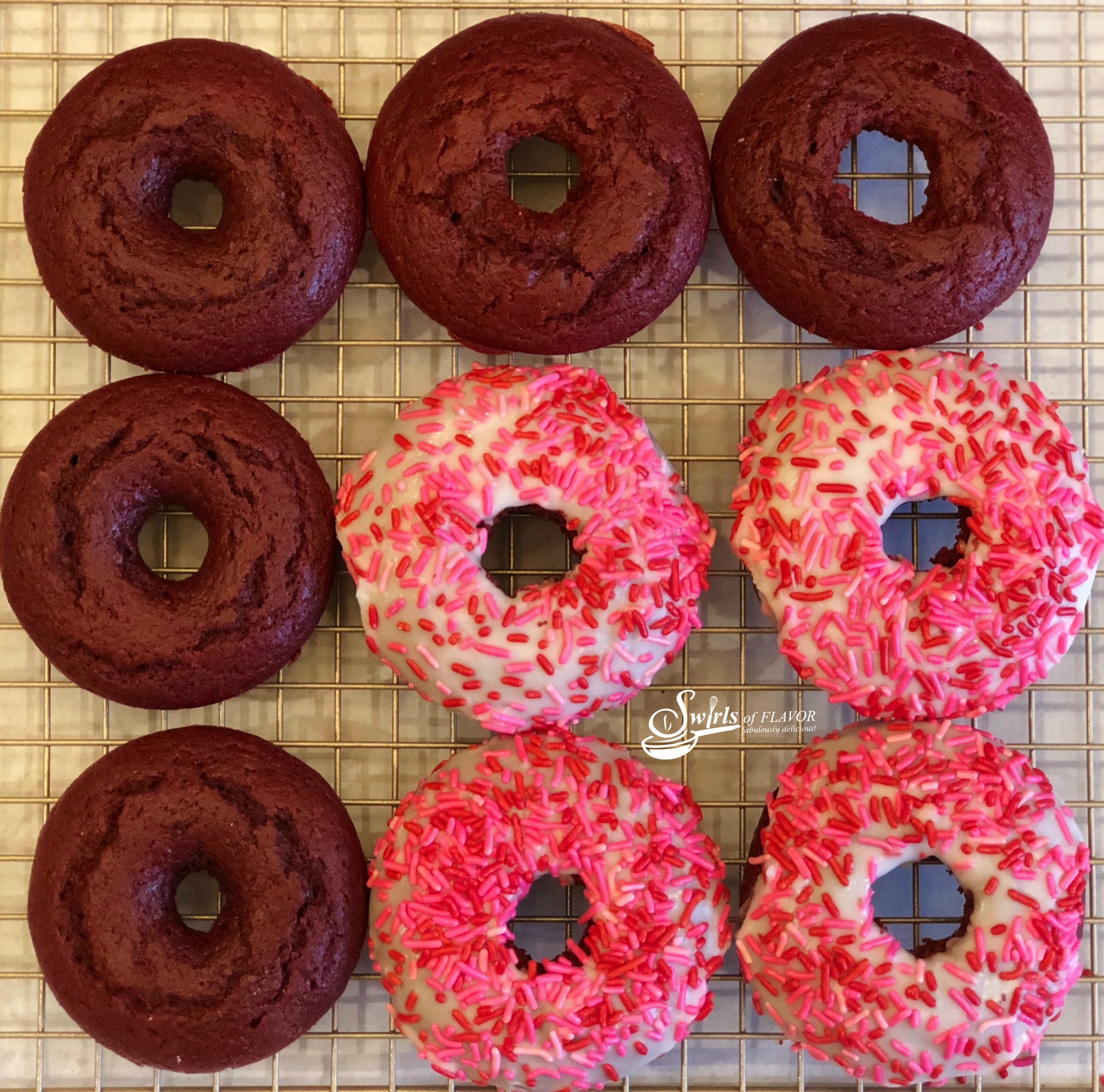 Love is in the air when you bake Red Velvet Donuts! Intense red color, cake-like texture and deep chocolate flavor make them perfect for Valentine's Day! easy dessert | baked donuts | red velvet | Valentine's Day | fun for kids