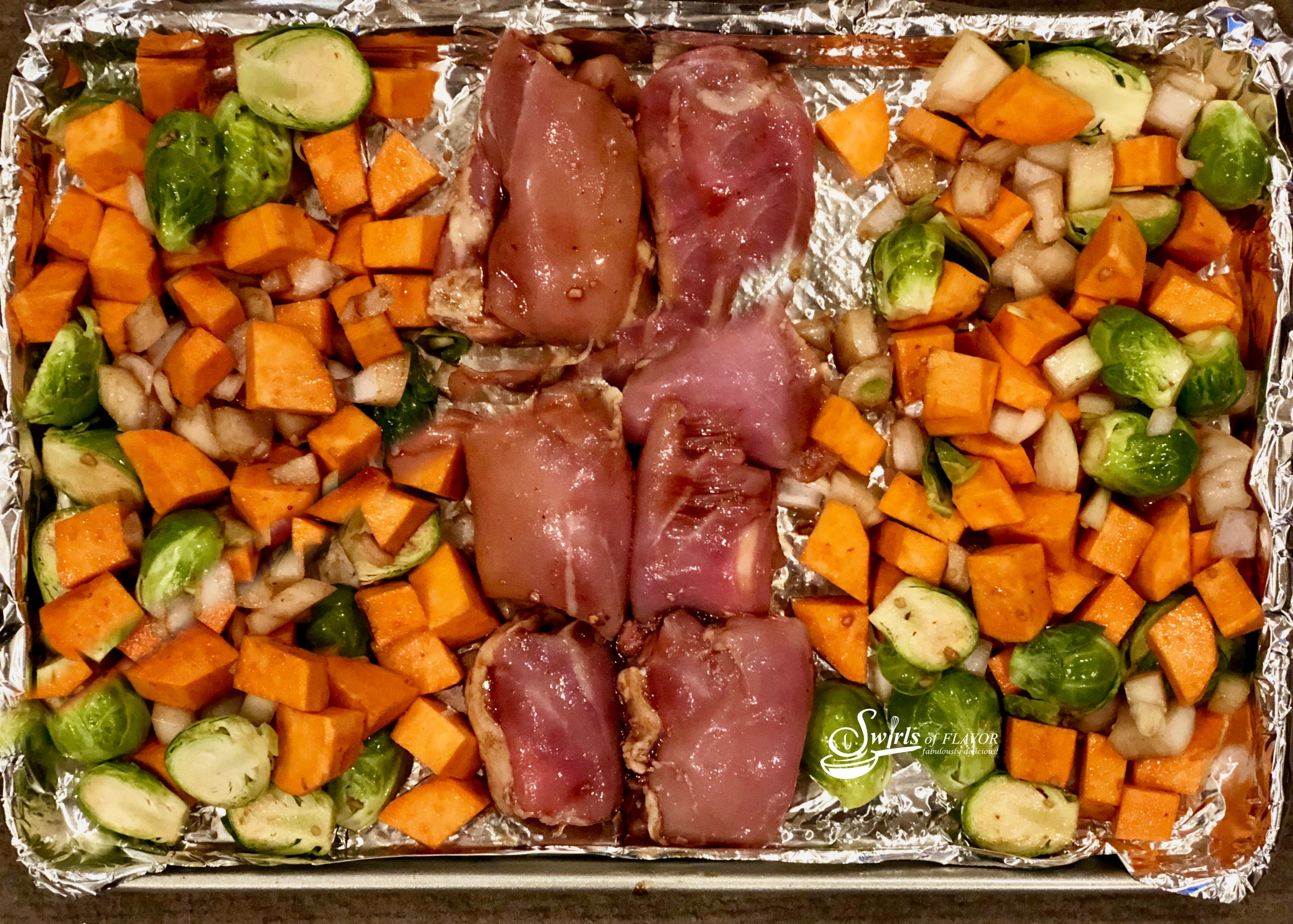 Sheet Pan Balsamic Chicken Thighs, Brussel Sprouts & Sweet Potatoes roast together in a balsamic honey sauce with just a hint of heat. sheet pan | dinner | easy | recipe | chicken thighs | honey | balsamic vinegar