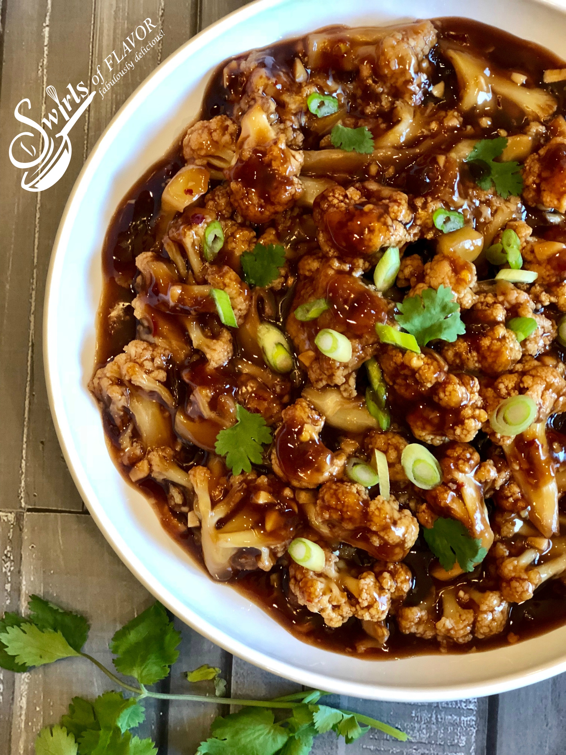 General Tso cauliflower with chinese sauce in white bowl