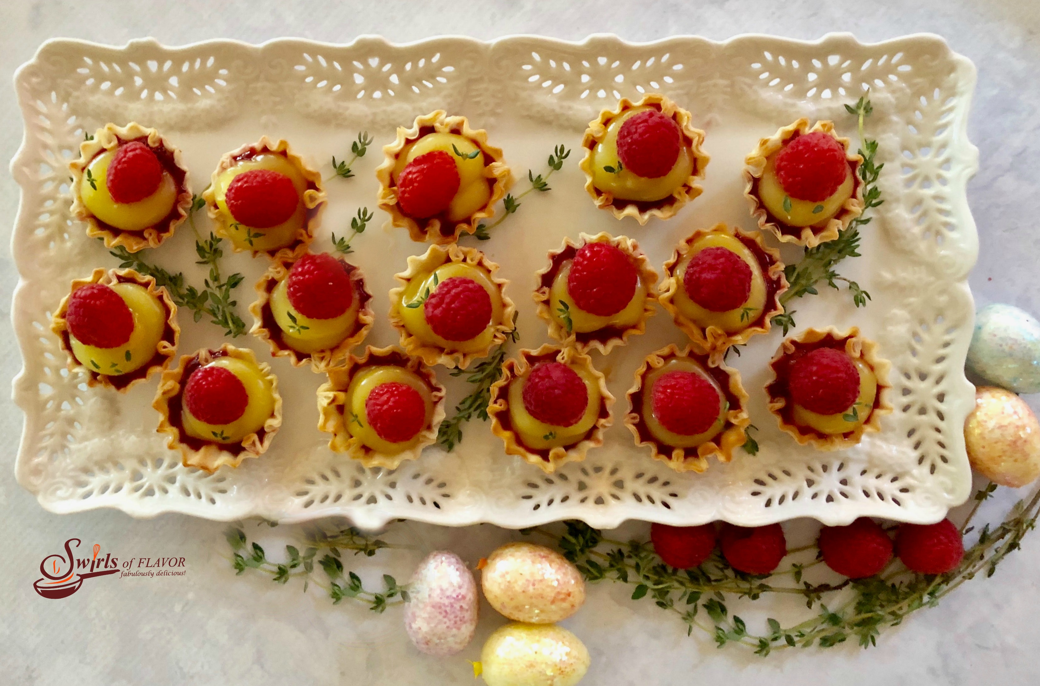 No-Bake Raspberry Lemon Thyme Tartlets are a 5 ingredient quick and easy dessert that's bursting with spring flavors and fruity sweetness! lemon | raspberry | thyme | fillo shells | mini dessert | no bake | no cooking | fresh herbs | easy recipe | #swirlsofflavor