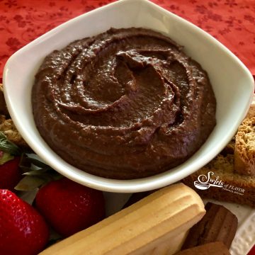 Nutella Hummus combines chickpeas, cocoa powder and hazelnut spread for a protein packed sweet dessert dip that's easy to make and a perfect healthy sweet treat for your next dessert. recipe | easy | dessert | hazelnut | Nutella | hummus | healthy | #swirlsofflavor