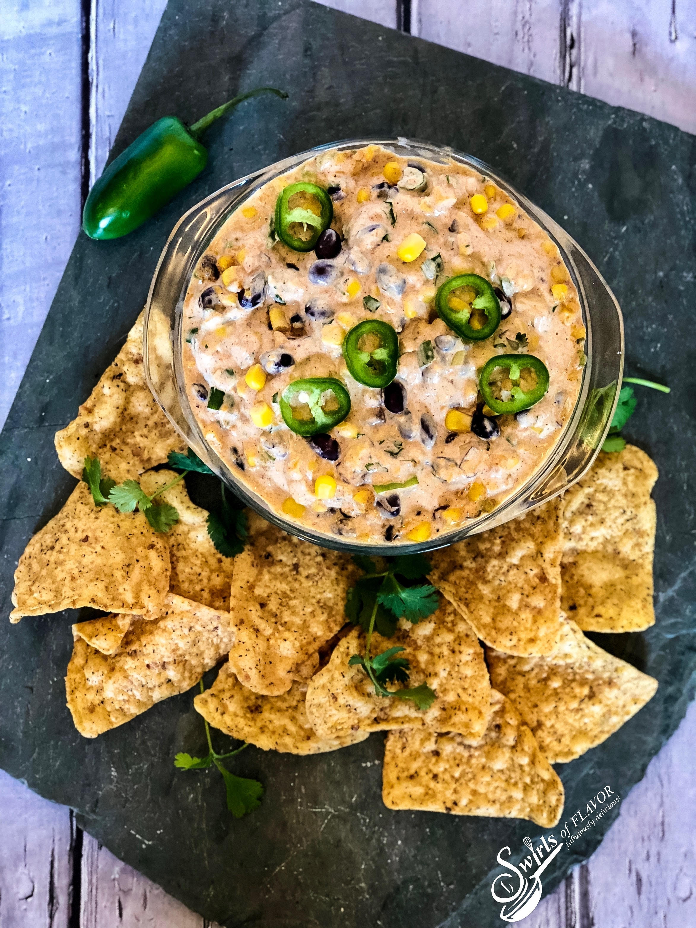 black bean dip in bowl with chips