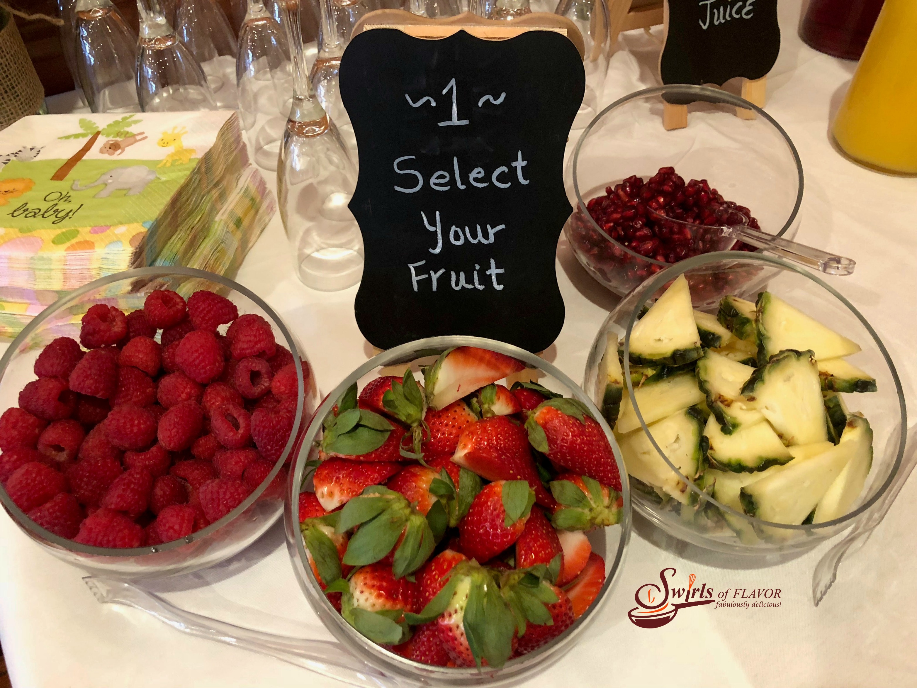 Select your fruit sign with bowls of fresh fruits