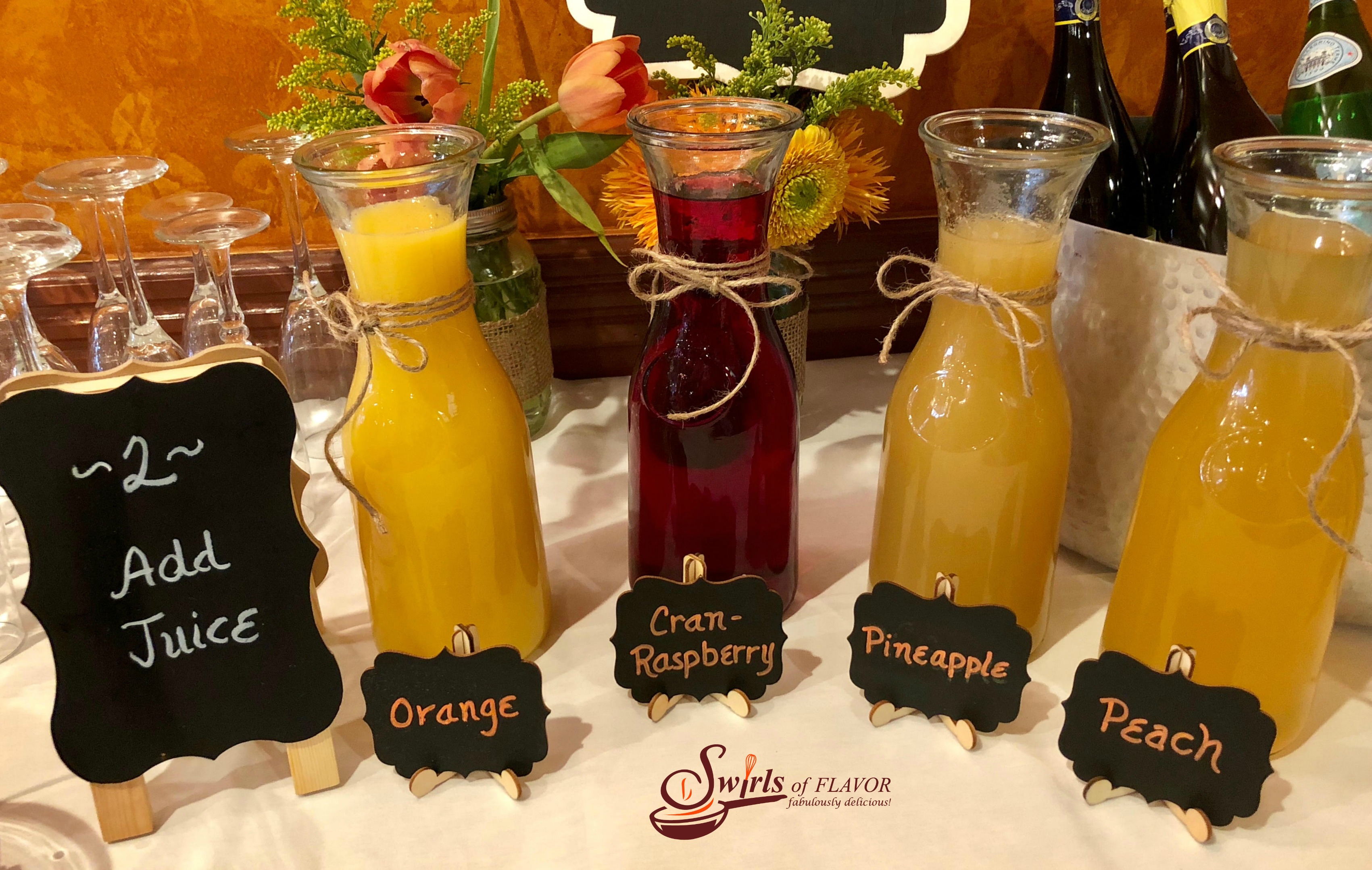 Juices in carafes with Add Juice chalkboard sign