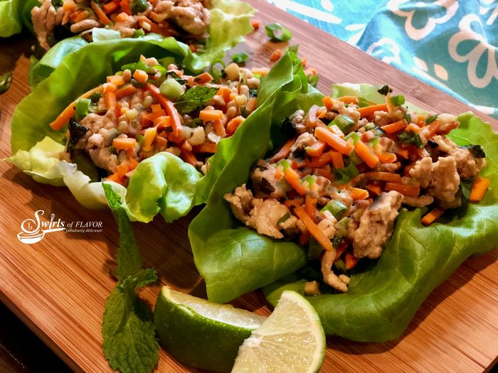 Thai Chicken Lettuce Wraps is an easy dinner recipe bursting with fresh ginger, garlic and Thai basil, that cooks on the stove top and is served in buttery lettuce leaves with a drizzle of fresh lime. 