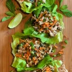 Thai Chicken Lettuce Wraps is an easy dinner recipe bursting with fresh ginger, garlic and Thai basil, that cooks on the stove top and is served in buttery lettuce leaves with a drizzle of fresh lime.