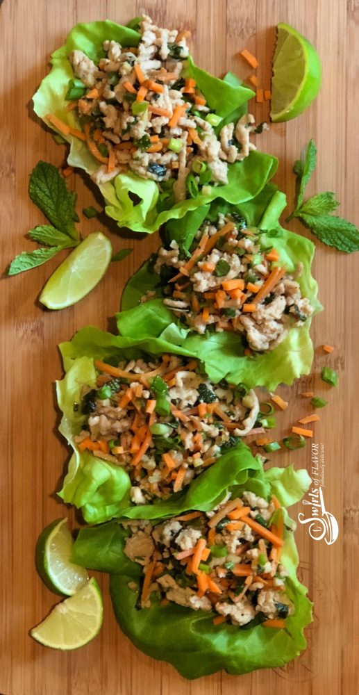 Thai Chicken Lettuce Wraps is an easy dinner recipe bursting with fresh ginger, garlic and Thai basil, that cooks on the stove top and is served in buttery lettuce leaves with a drizzle of fresh lime. 