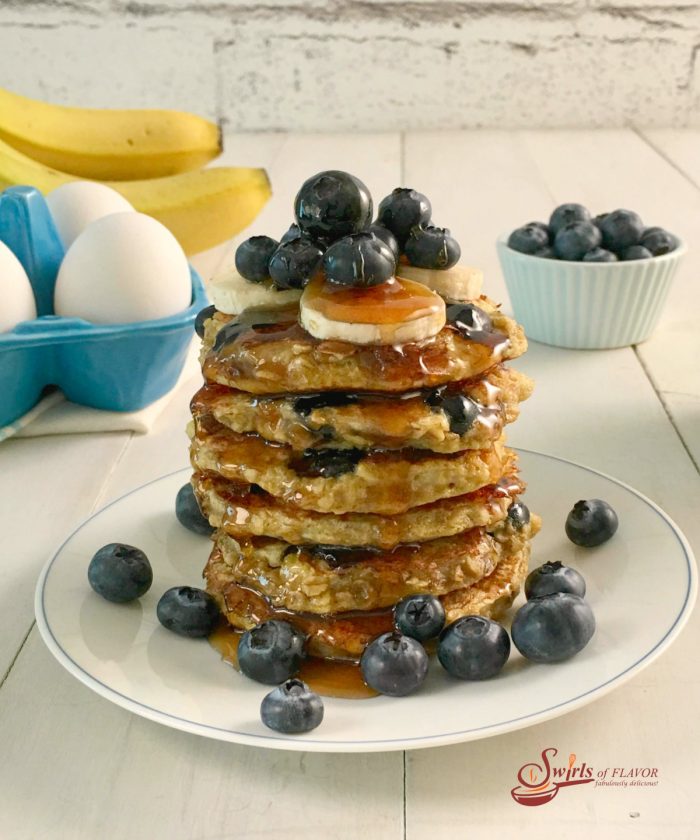 stack of gluten free blueberry pancake recipe with fresh blueberries and syrup