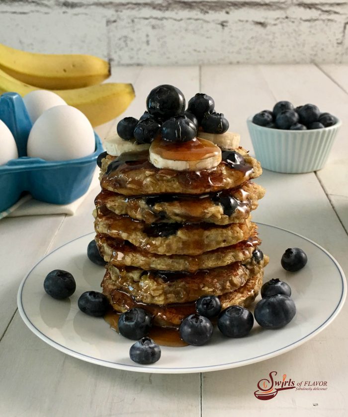 With just four ingredients, you'll happily be making these from-scratch pancakes Gluten-Free Blueberry Pancakes over and over again for breakfast. easy | homemade | pancakes | gluten free | blueberry | banana | breakfast | brunch | #swirlsofflavor