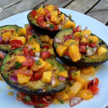 grilled avocados topped with fresh mango salsa