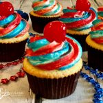 4th of July cupcakes are simple from-scratch vanilla cupcakes topped with a homemade buttercream frosting decorated with red and blue stripes and topped with a cherry. Perfect for your patriotic celebration!