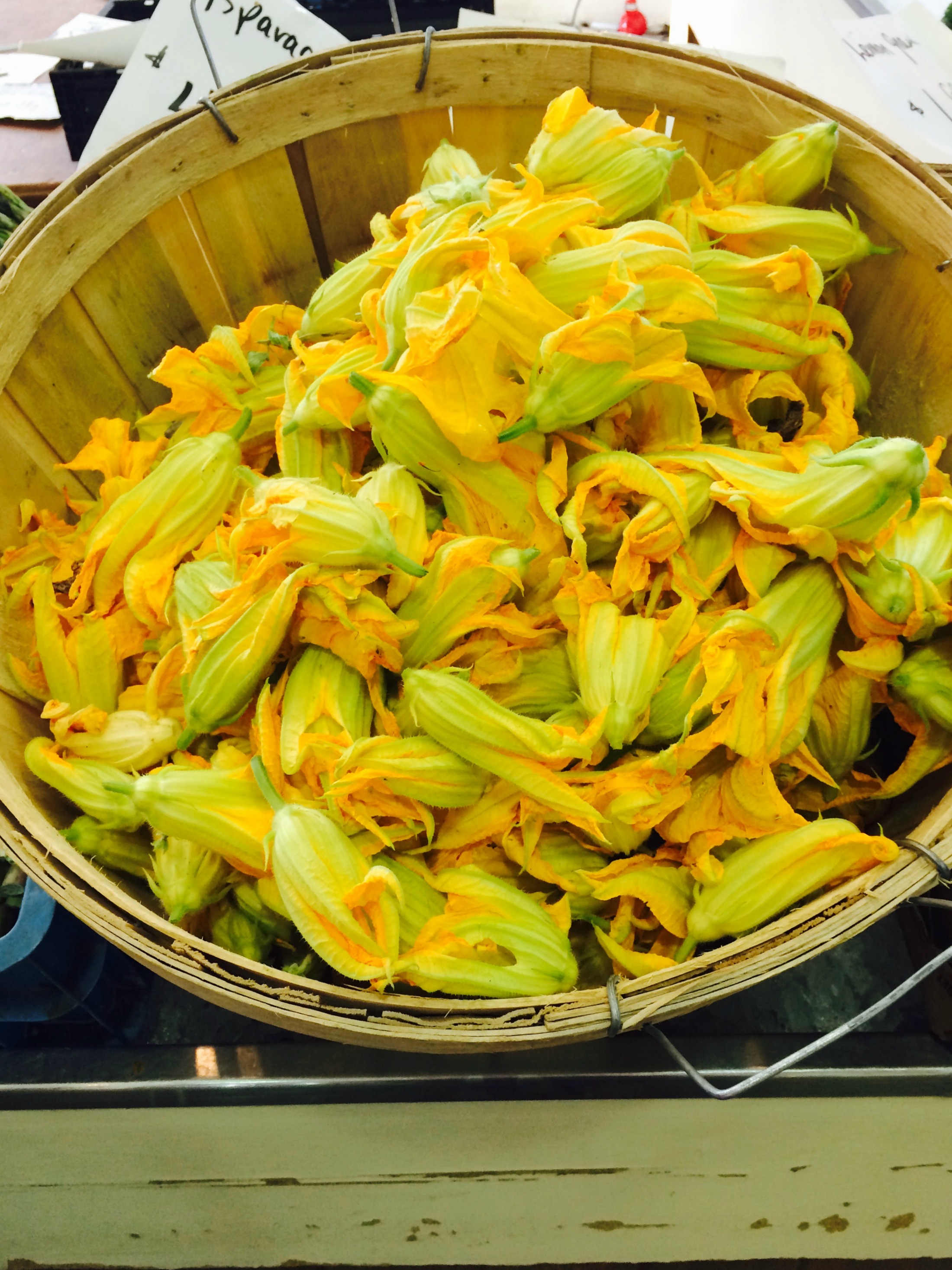 Squash blossoms in basket