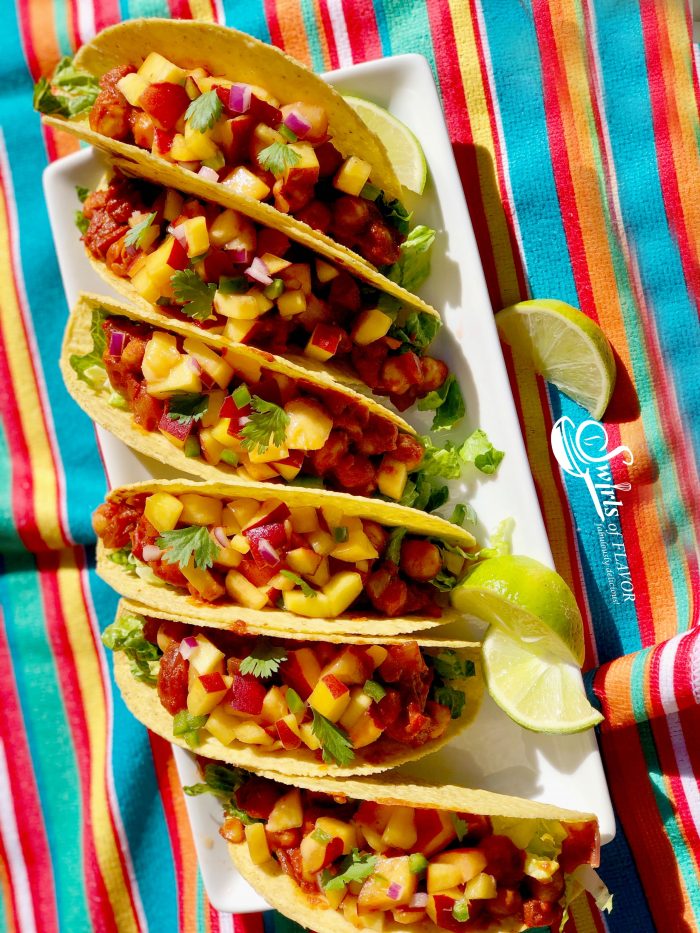 Vegan Chickpea Tacos With Peach Salsa is an easy vegan recipe that's packed with the protein of chickpeas and topped with a lime-scented fresh peach salsa! tacos | Taco Tuesday | chickpeas | tomatoes | peaches | salsa | fruit salsa | summer recipe | #swirlsofflavor