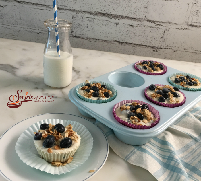 Made with fresh blueberries, yogurt and granola, Triple Citrus Blueberry Frozen Yogurt Cups are a refreshing and nutritious frozen snack, dessert or breakfast and the perfect way to cool off on a hot day. #blueberries #granola #Greekyogurt #frozendessert #snack #funforkids #kidfriendly #easyrecipe #summer #breakfast #brunch #swirlsofflavor