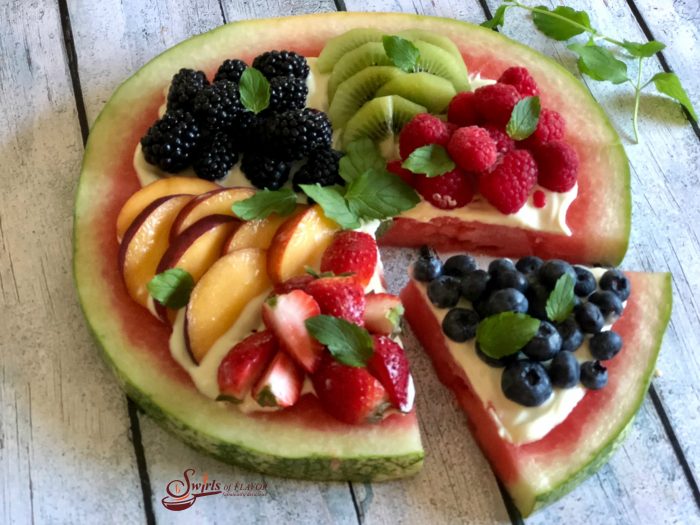 Watermelon Pizza is an easy dessert bursting with fresh summer fruits, mint and lime Greek yogurt! So much fun for kids and healthy too! #easydessert #berries #summerfruit #watermelon #fruitpizza #funforkids #swirlsofflavor