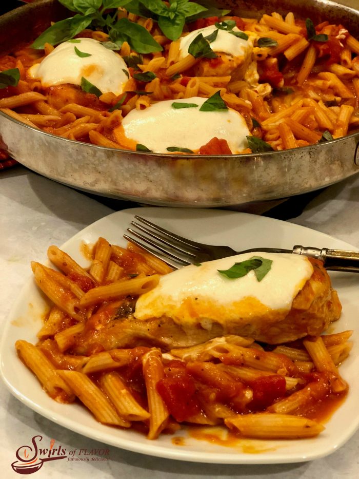 One Pot Chicken Parmesan Pasta is an easy recipe bursting with all the flavors of Chicken Parmesan, seasoned chicken, penne pasta, tomato sauce and cheese, that cook up all together for a quick weeknight dinner that's ready in just 30 minutes! #onepotdinner #chickenparmesan #skilletdinner #pasta #penne #easydinner #weeknightdinner #lessthan30minutes #cheese #onepot #swirlsofflavor                   