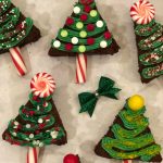 Christmas Tree Brownies is an easy homemade brownie recipe that's a merry holiday treat. Simply cut brownies into triangles and decorate with a homemade buttercream frosting, candy canes, candy, sprinkles and edible glitter! Make Christmas even more fun and festive with Christmas Tree Brownies! #brownies #homemade #baking #holiday #Christmas #funforkids #Christmastrees #candycanes #swirlsofflavor