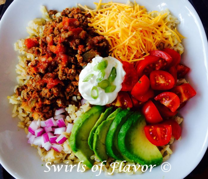 taco bowl with brown rice and taco toppings