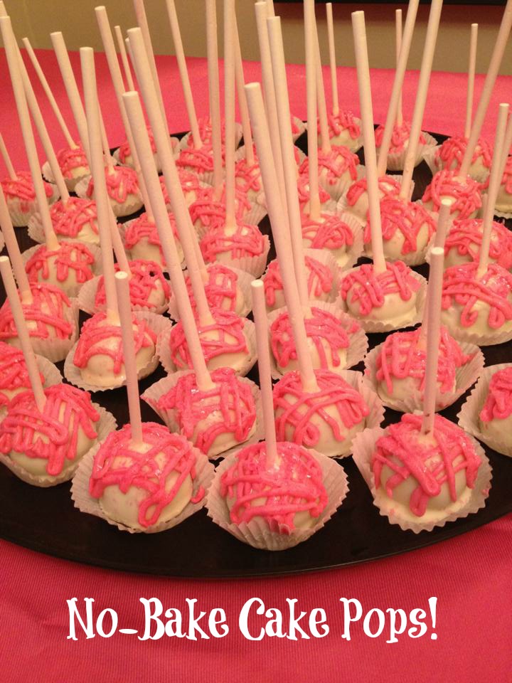 pink and white cake balls with lollipop sticks