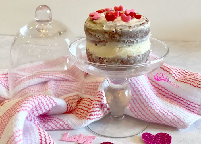Our Red Velvet Mini Layer Cakes is an easy from scratch cake recipe for your Valentine's Day dessert. Our mini homemade cake layers have a deep intense red color and are flavored with cocoa powder for a delicious chocolate flavor. Red Velvet Mini Layer Cakes are perfect for sharing on Valentine's Day. #redvelvet #valentinesday #valentinesdessert #minilayercake #minilayercakes #redvelvetcake #dessertfortwo #swirlsofflavor
