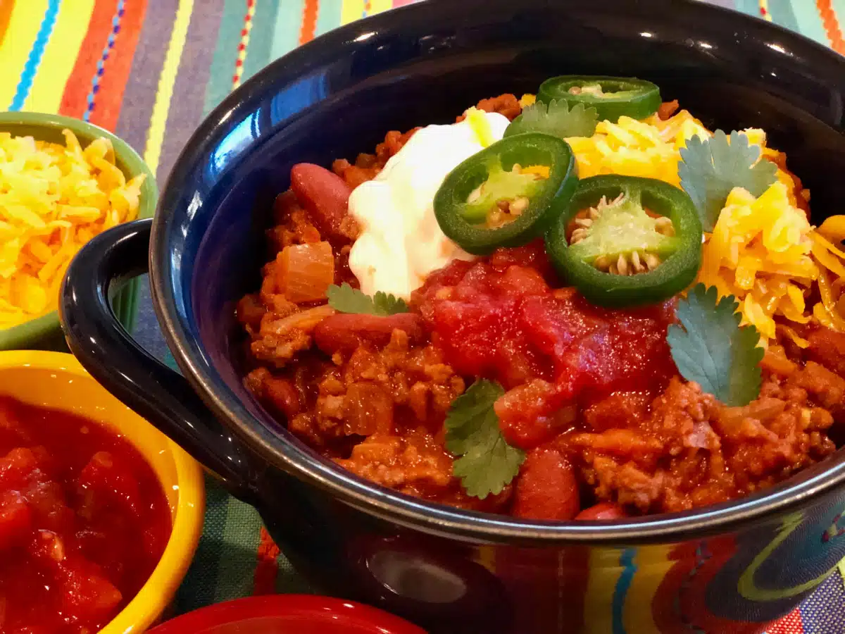 chili with beans and toppings in a bowl