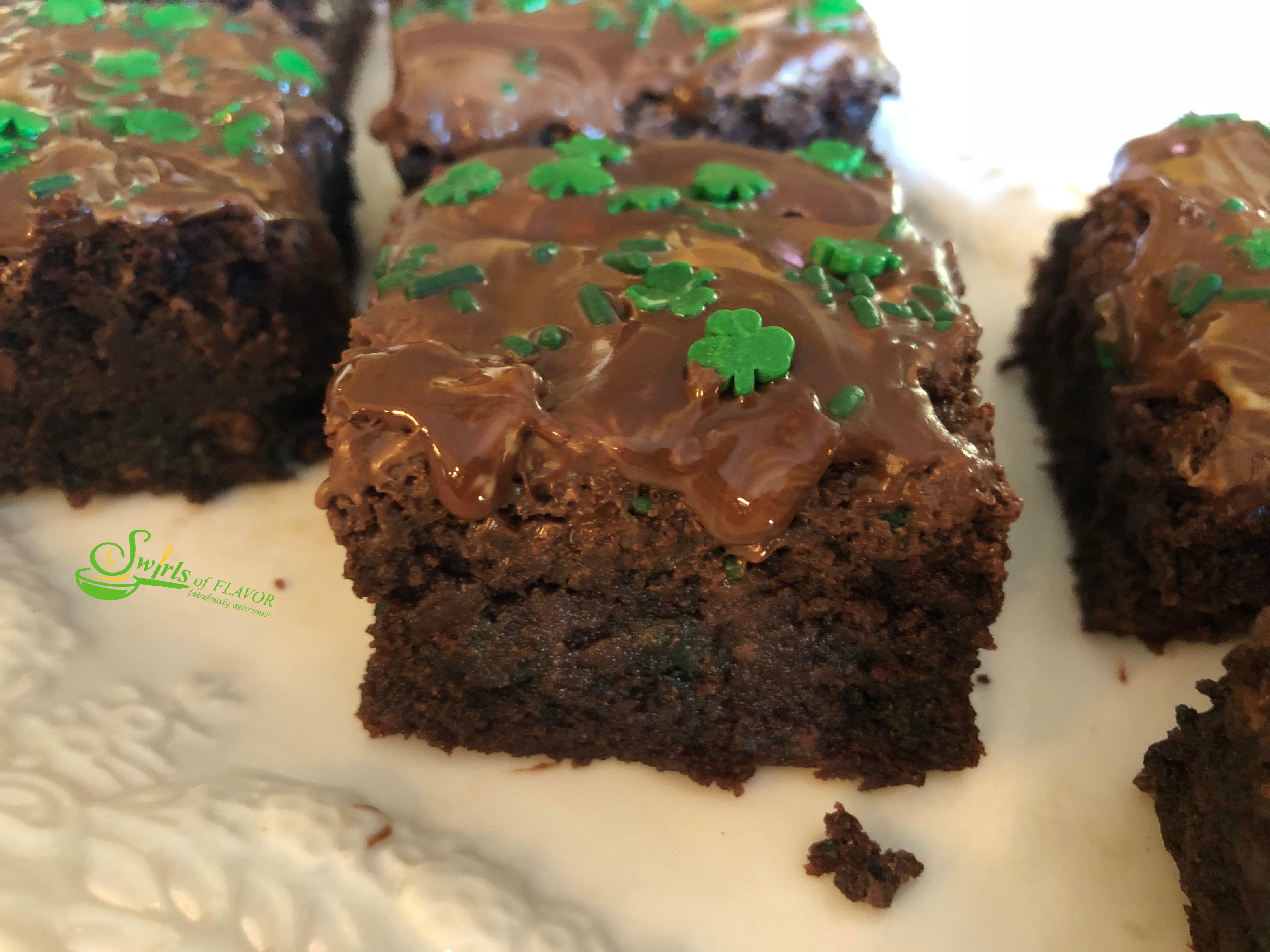 Homemade Chocolate Chip Mint Brownies, topped with a one ingredient mint frosting, is an easy dessert recipe for your Saint Patrick's Day celebration!