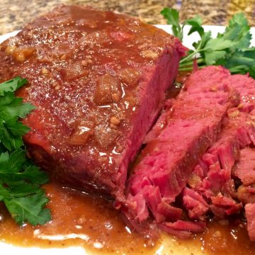 slow cooker corned beef recipe with slices and guinness sauce