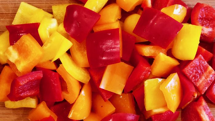 Red and yellow bell peppers cut in 1-inch pieces