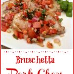 Pork chops with a tomato opiing on white dish