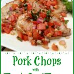 Boneless pork chops with a frresh tomato topping on a white latter