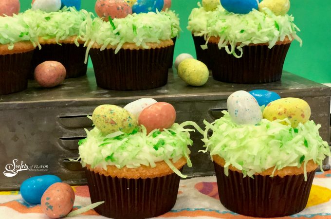 Easter Egg Coconut Cupcakes are homemade coconut cupcakes and coconut buttercream frosting decorated with shredded coconut and malted milk robin egg candy. A perfect Easter dessert!