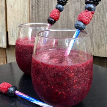 frozen sangria in stemless wine glasses with fresh berries