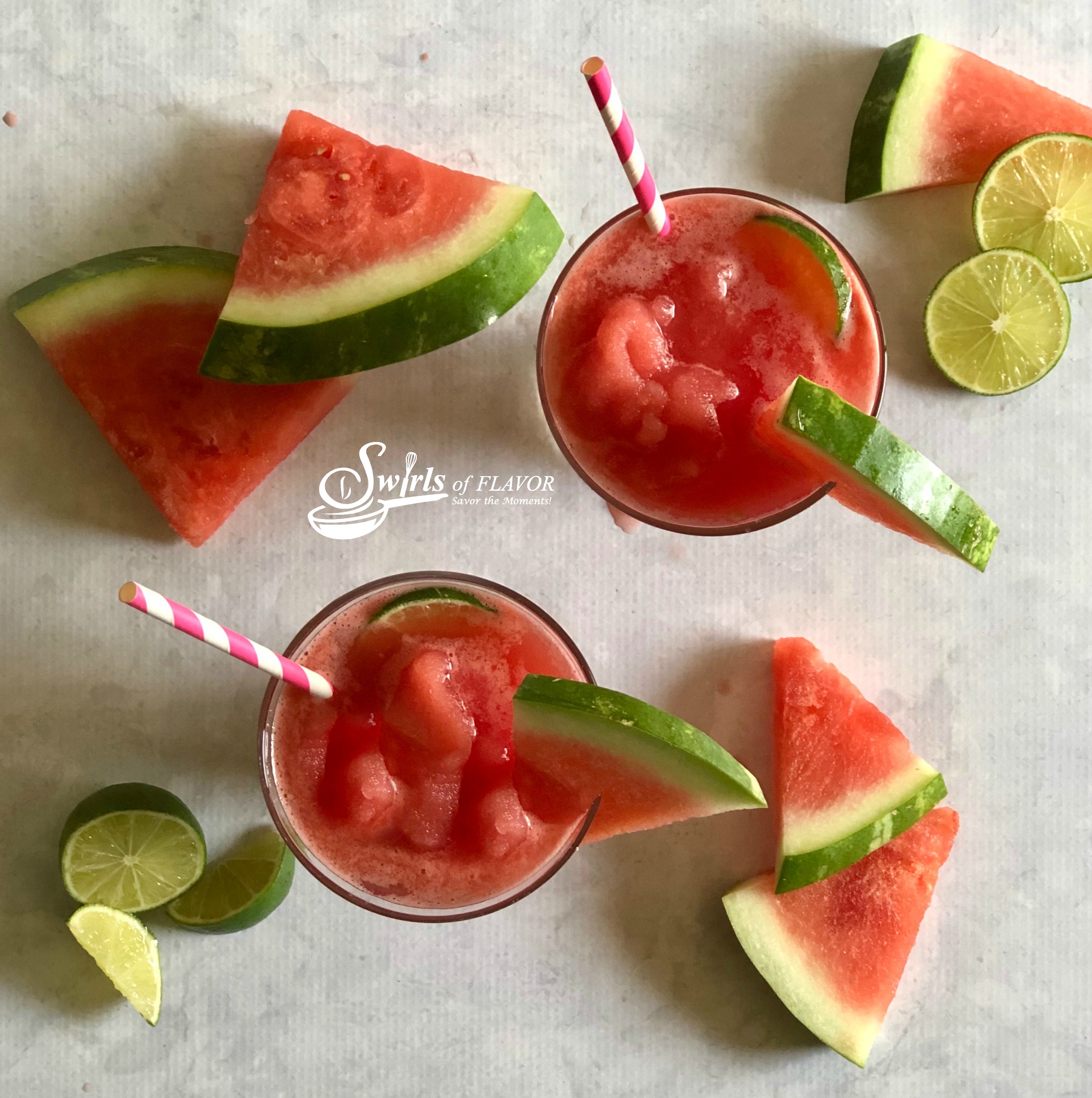overhead picture of watermelon cocktails with fresh lime and watermelon slices