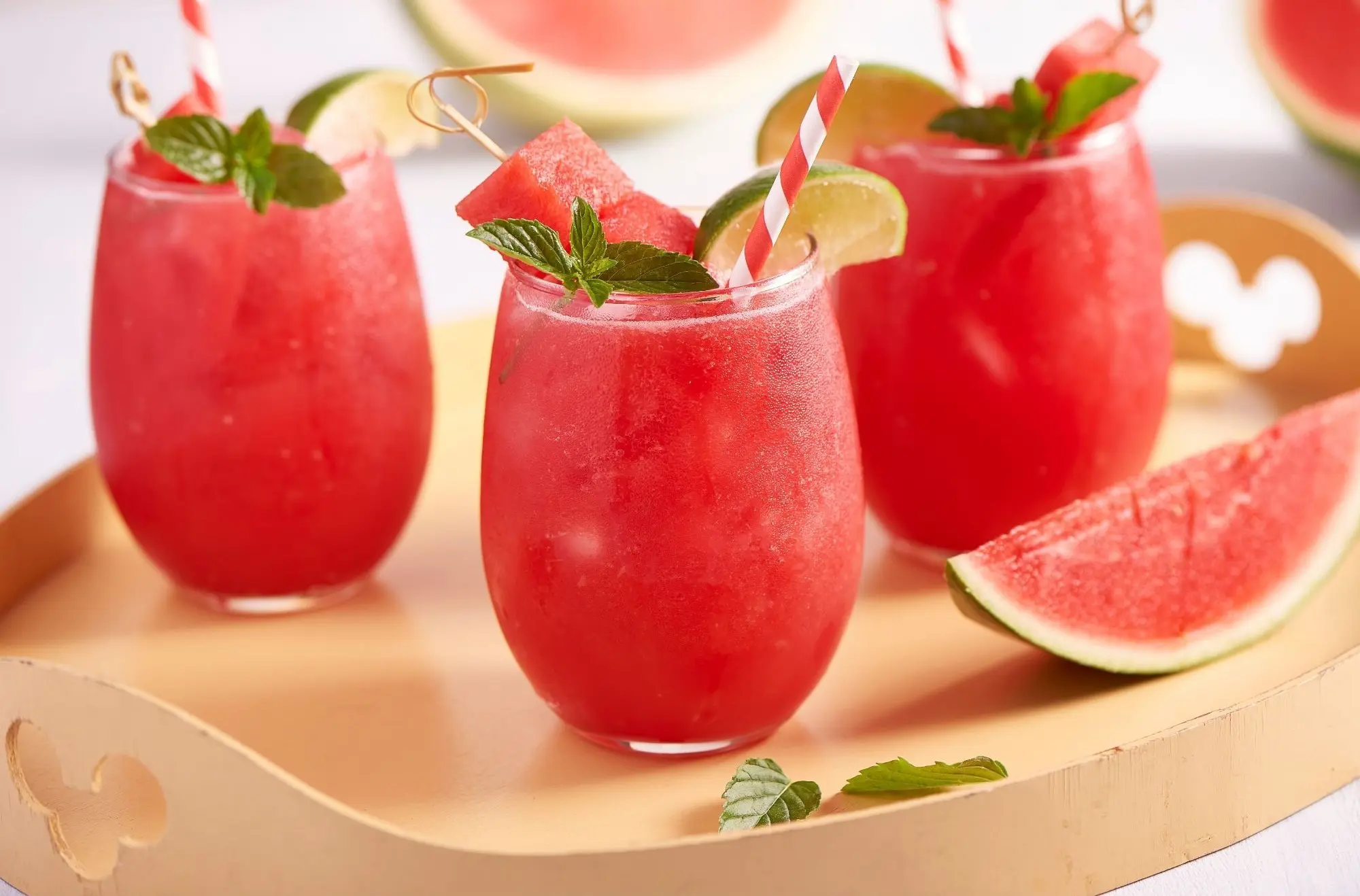 frozen watermelon drinks in stemless wine glasses