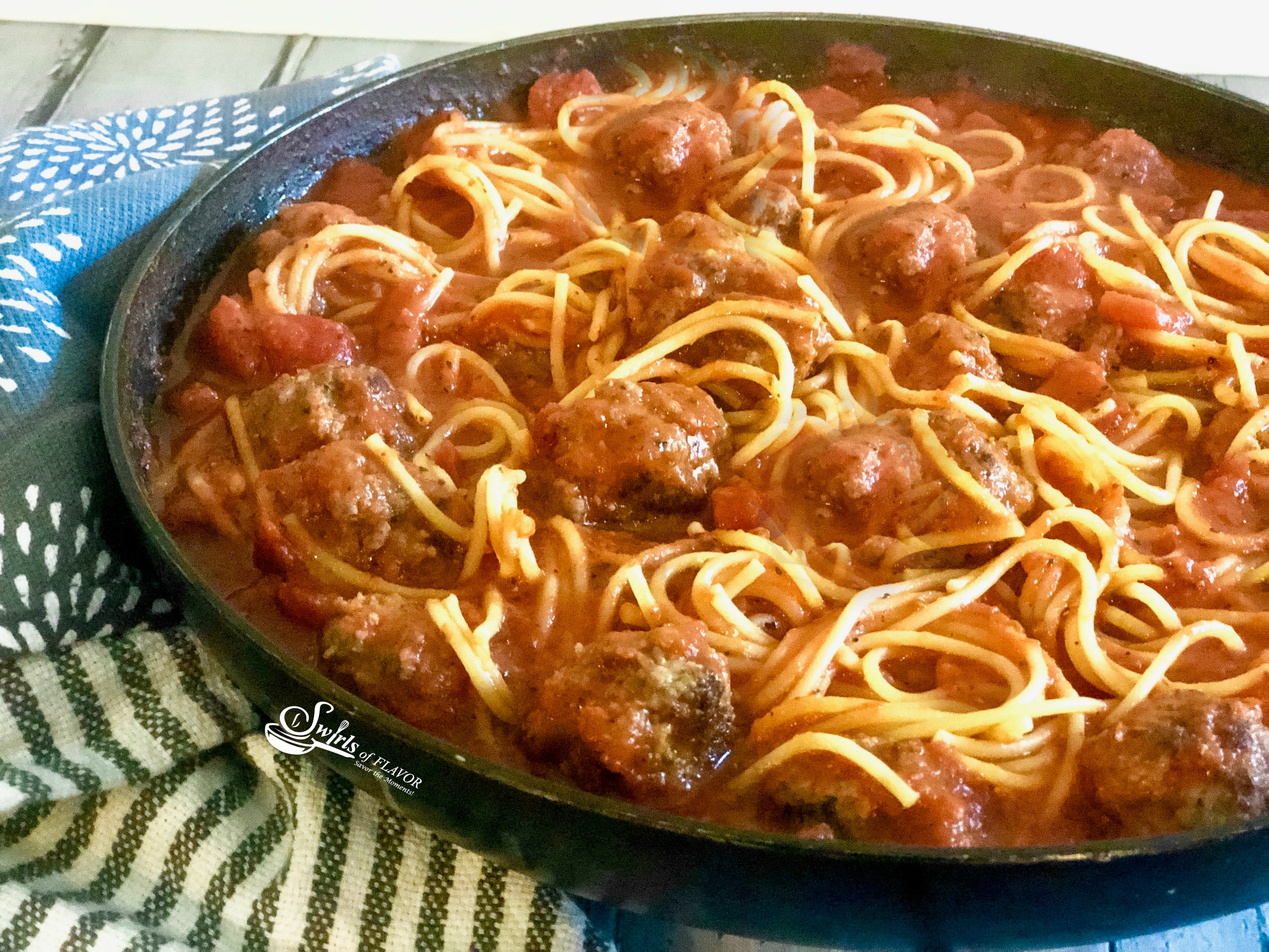 Spaghetti and meatballs in skillet