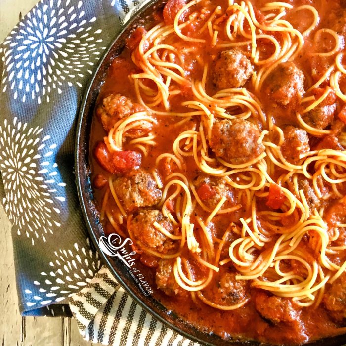 Spaghetti and meatballs in skillet