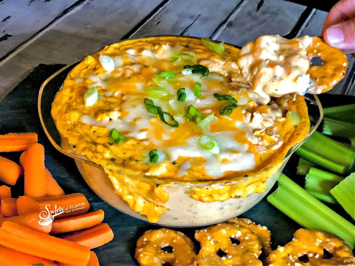 buffalo chicken dip with scoop on a chip