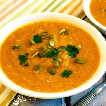 carrot ginger soup with pumpkin seeds and cilantro