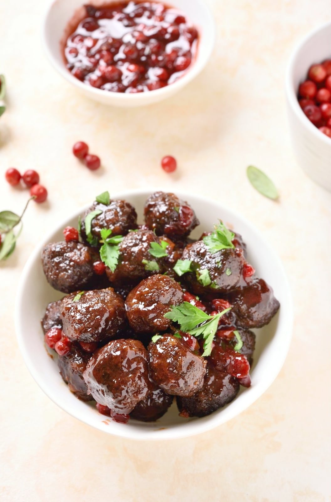 meatballs with cranberry sauce in white bowl