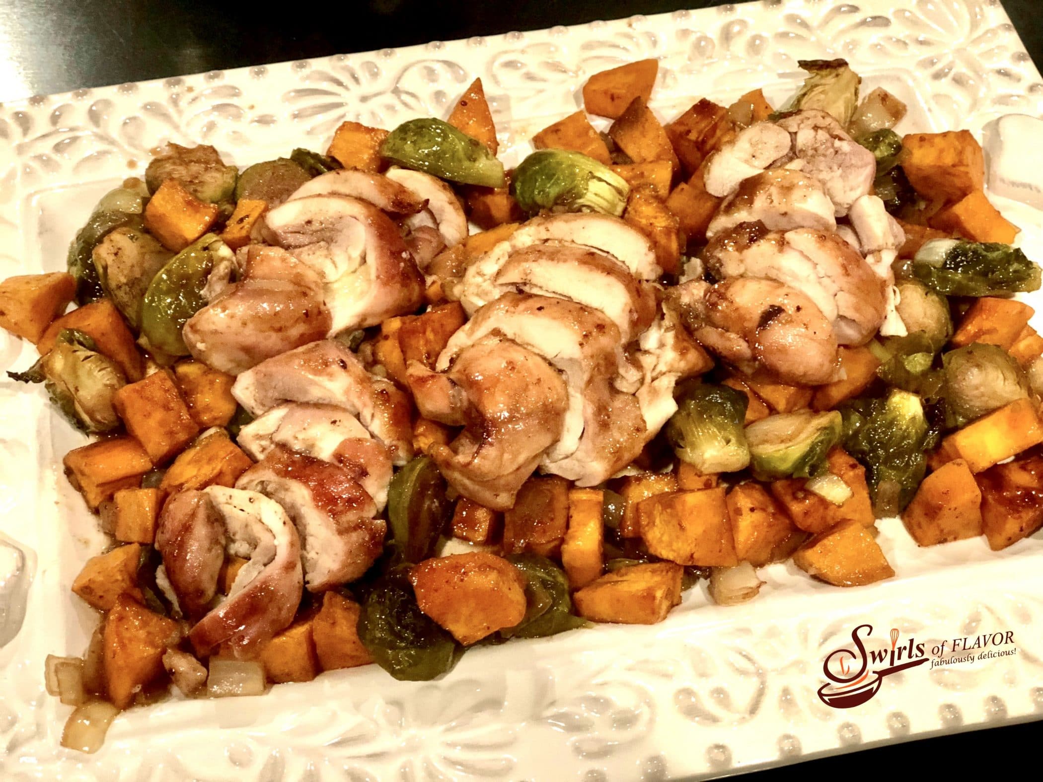 chhicken and sweet potatoes with brussels sprouts on white platter