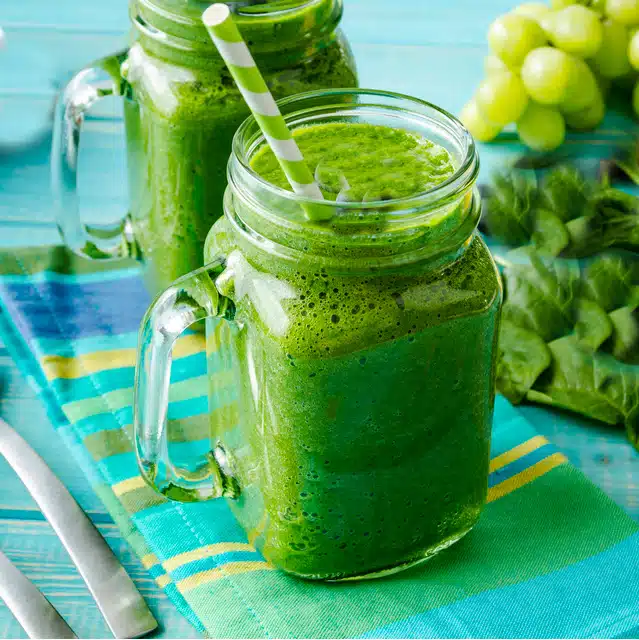 green tea kale smoothies in mason jars with handles