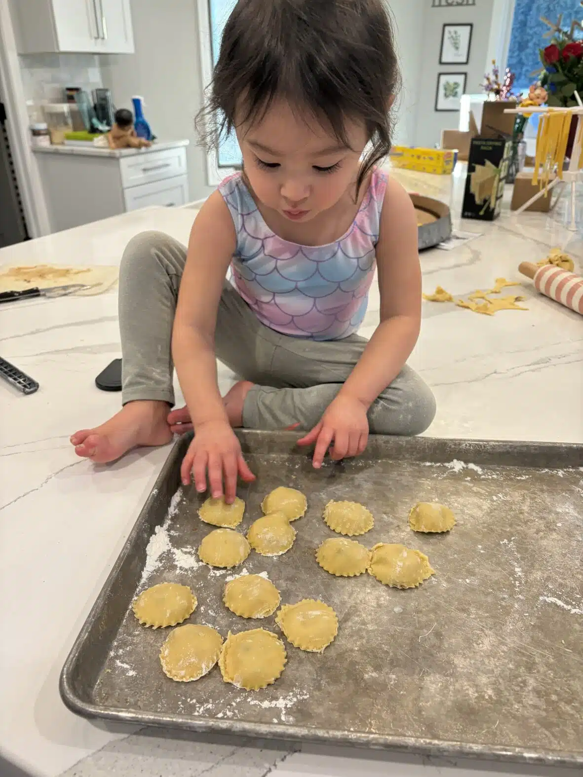 Mia counting the homemade ravioli
