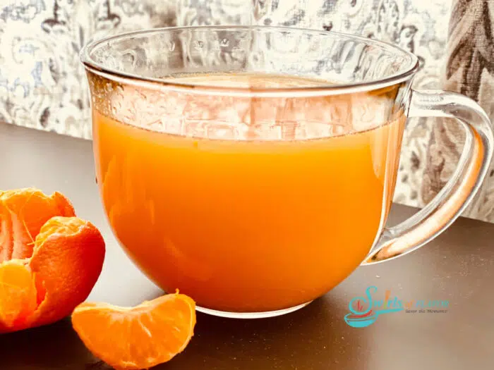 honey orange vitamin drink in a glass mug