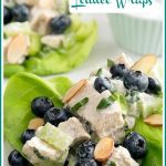 close up of chicken salad with blueberries and almonds in lettuce leaf