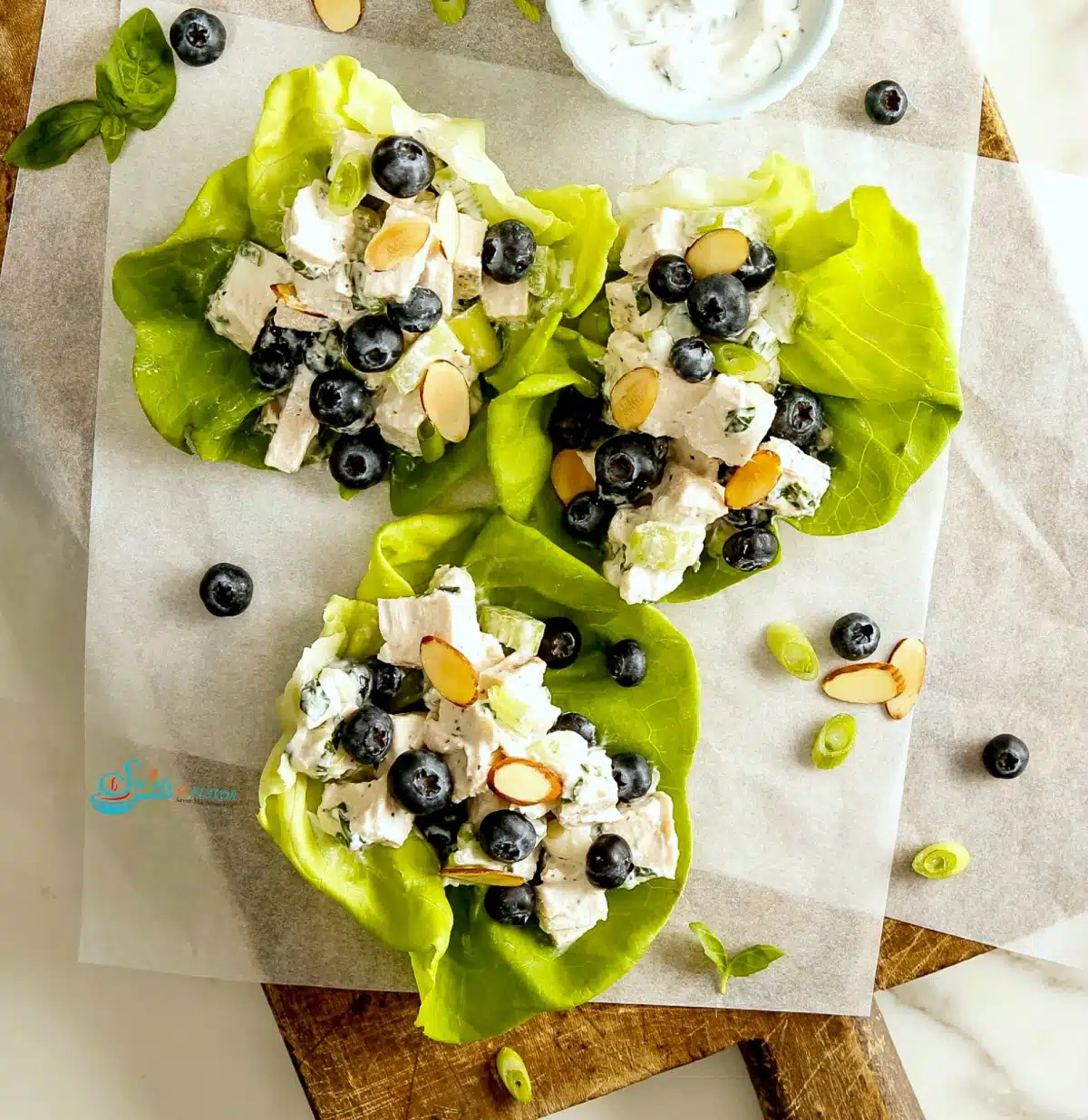 overhead photo of blueberry chicken salad lettuce wraps