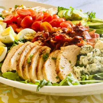 chicken cobb salad on white platter